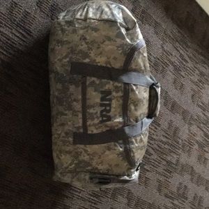 In our a duffel bag… New without tags, camo green